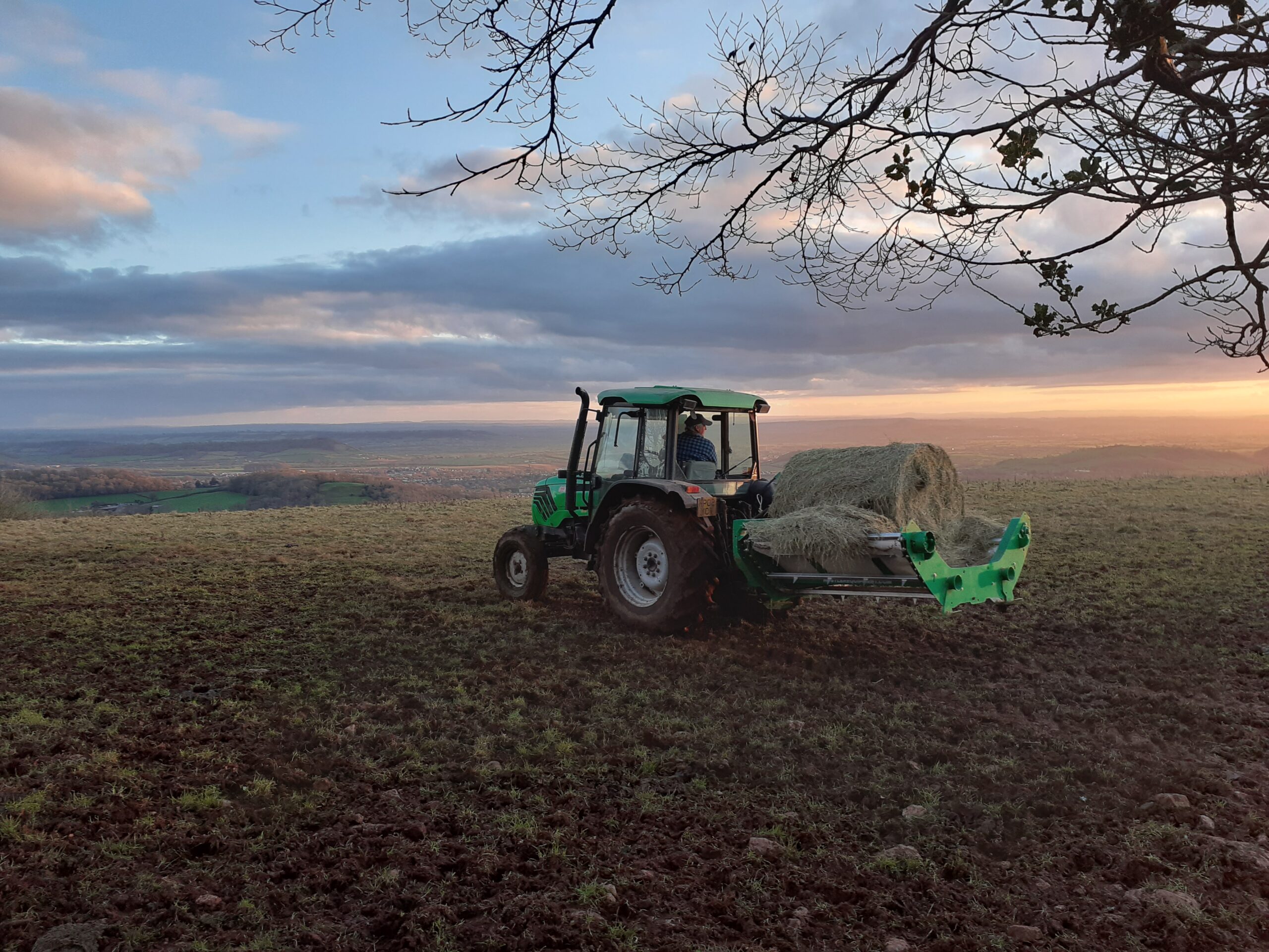 tractor and bale unroller