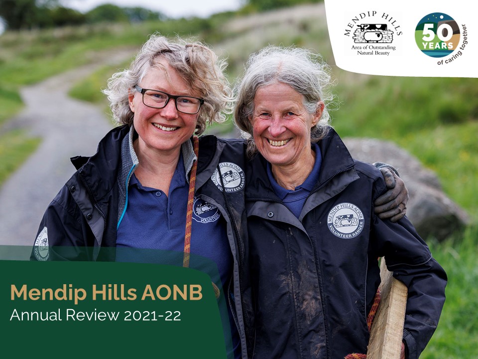 Cover Mendip Hills AONB annual review showing two smiling female volunteers