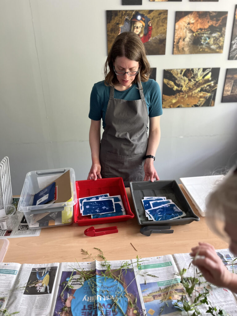 Photographic artist developing sun prints at a workshop